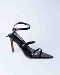 Black high-heeled sandal with clear strap on a white background