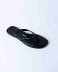 Black sandal with a brand logo on a light gray background